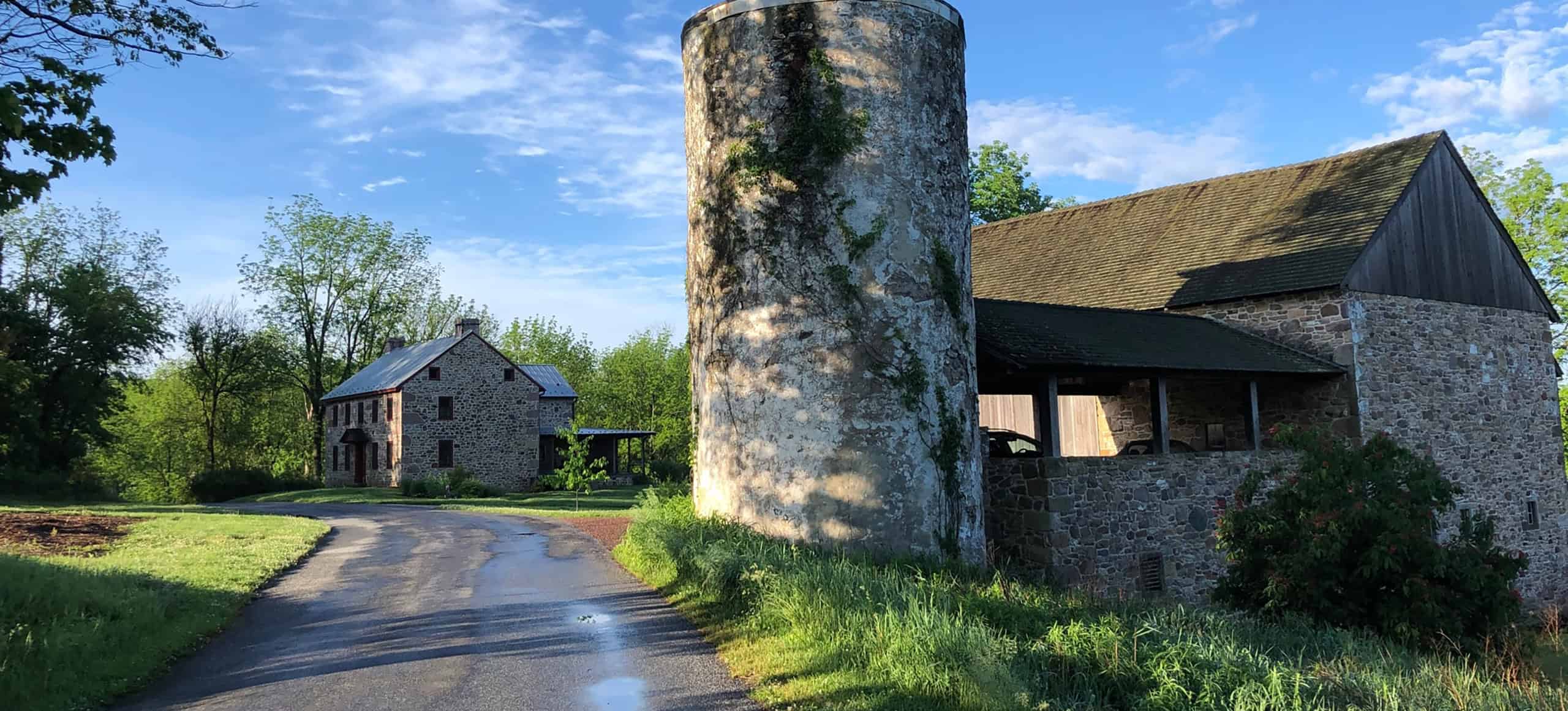 a path leading up toward an old 19th century barn.