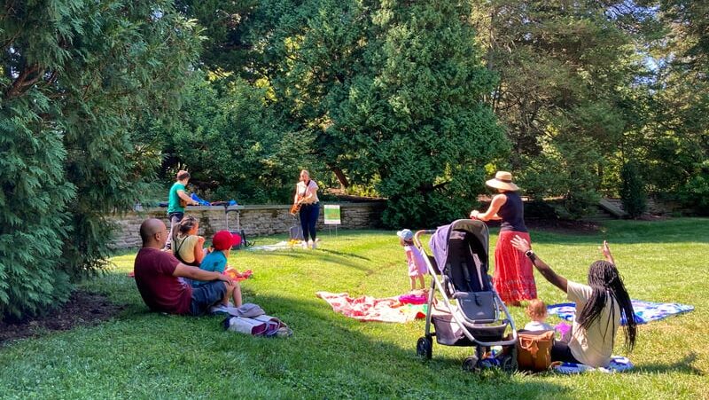 kids playing music in a circle garden