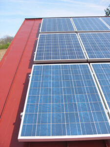 close up of solar panels on a red roof