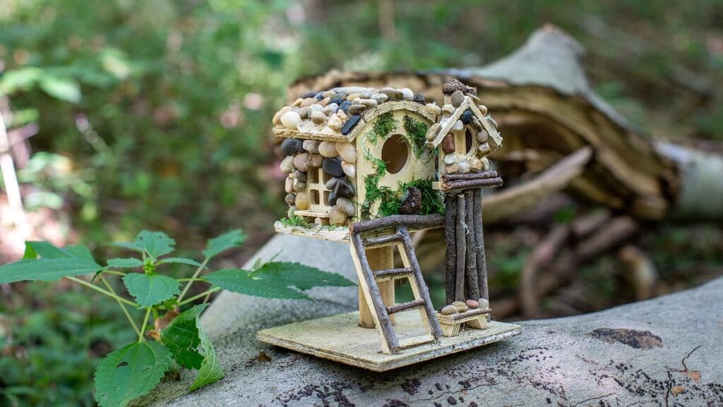 a miniature fairy house built out of natural materials
