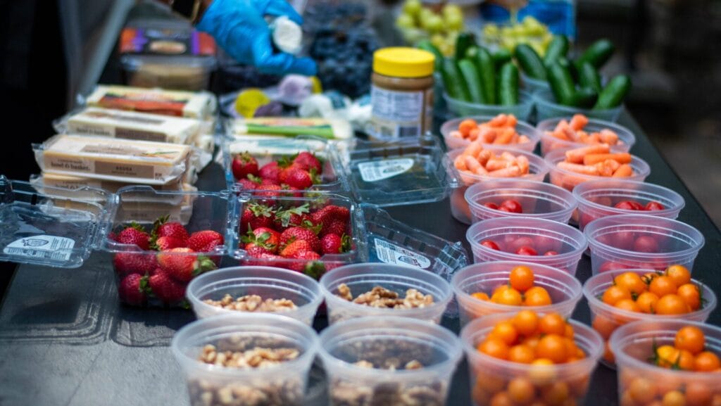 containers of various fruits, vegetables, and nuts