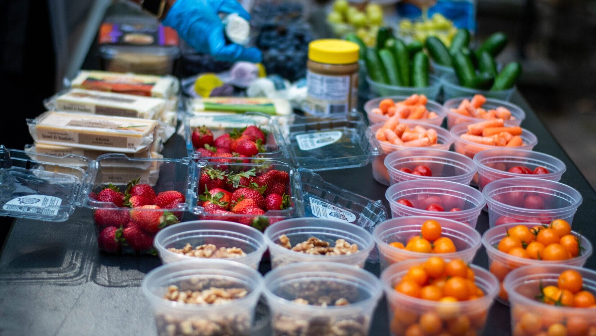 containers of various fruits, vegetables, and nuts