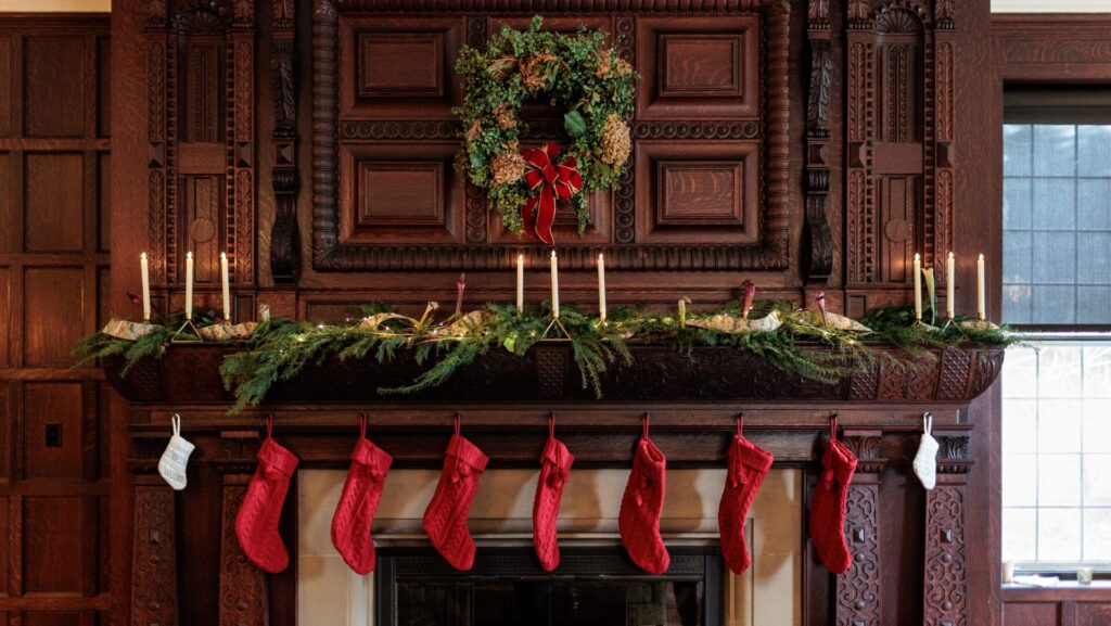Wooden fireplace mantel with holiday decor