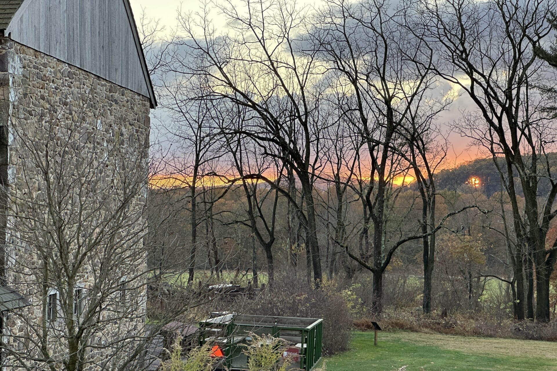 Sunset behind the trees on surrounding hills at Crow's Nest Preserve.