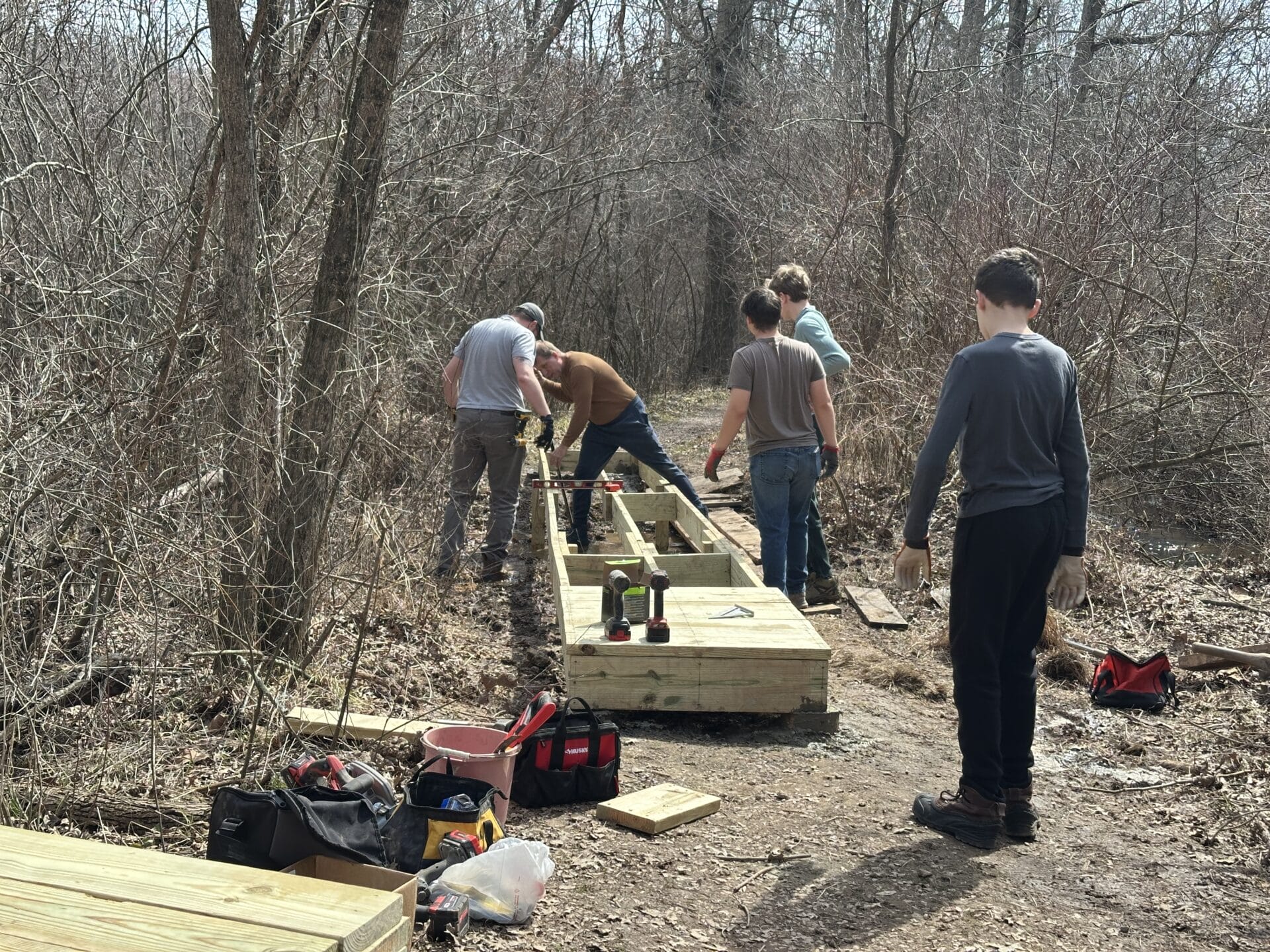 Scouts building a footbridge