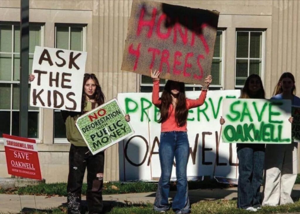Middle School students holding home-made signs in protest